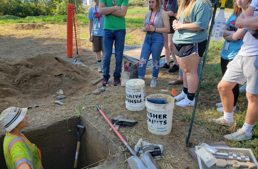 High school students visit archeology dig site