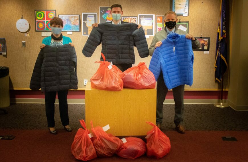 Business partners with school to provide students with coats, gifts