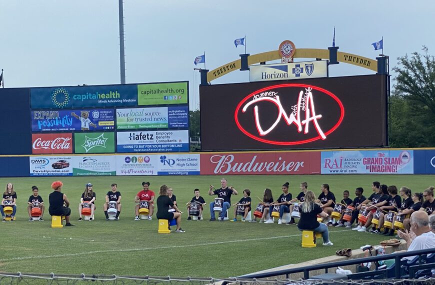 Drummers with Attitude performs at minor league baseball game