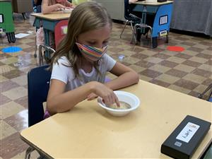 Students participate in kid-friendly activities to learn about pandemic guidelines