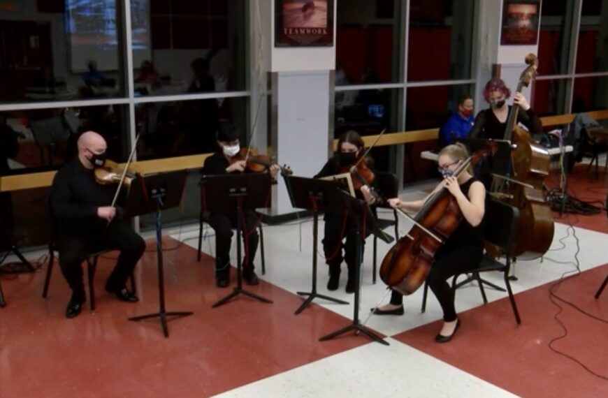 High school quintet serenades members of the school board