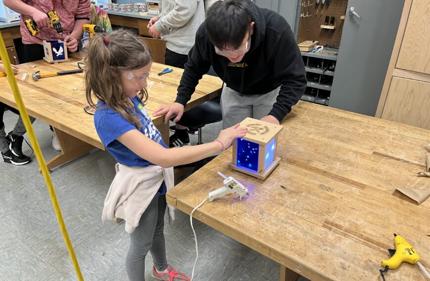 Intergenerational technology education project connects students and schools