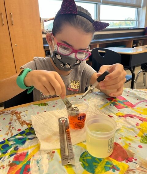 Students conduct experiments for National Chemistry Week